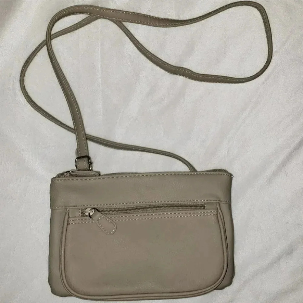 Tan small vinyl crossbody with multi zip pockets